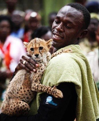 FunnyPicsDepot's tweet photo. Usain Bolt celebrates his victory with his son https://t.co/InP1TQWfHB