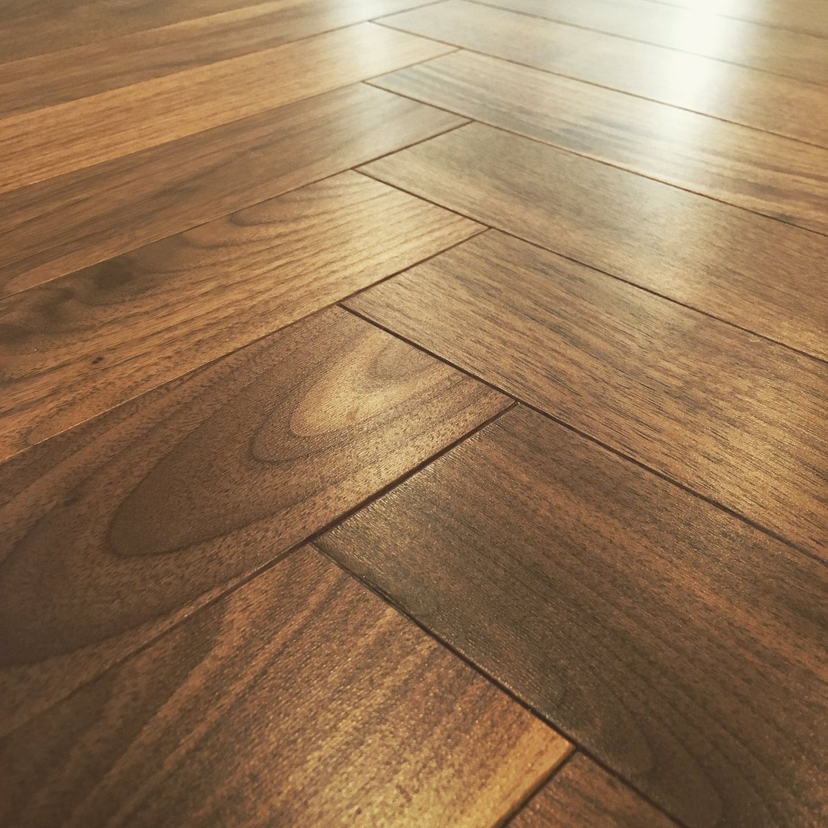 BraidFlooring's tweet photo. Walnut hardwood on its own is stunning. But we installed this one in a herringbone pattern to add a classical touch https://t.co/ucLaDubCI4