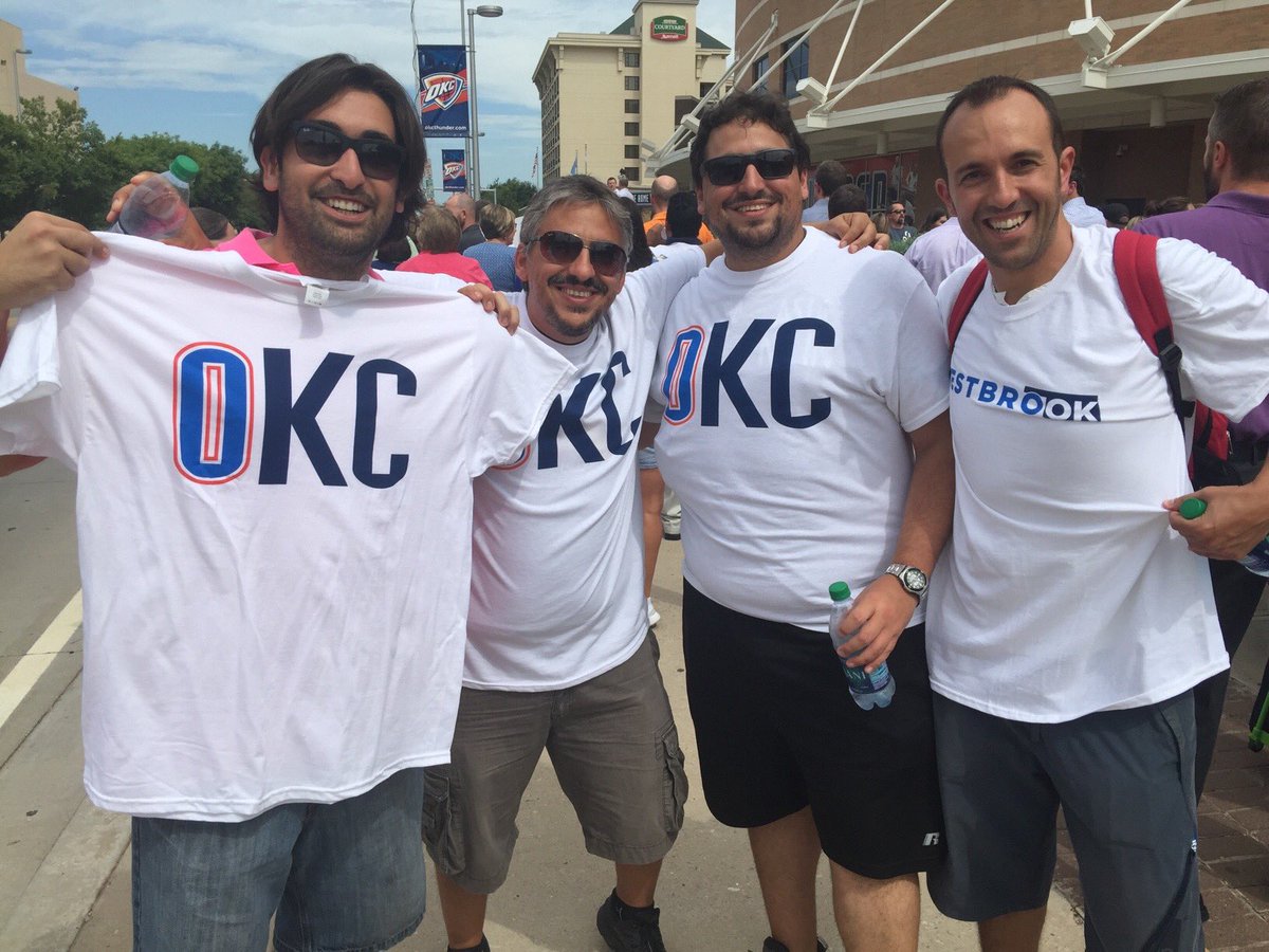 BoomtownHoops's tweet image. Fans out here in the streets with the shirts being handed out. It's scalding hot and Oklahomans don't care at all.