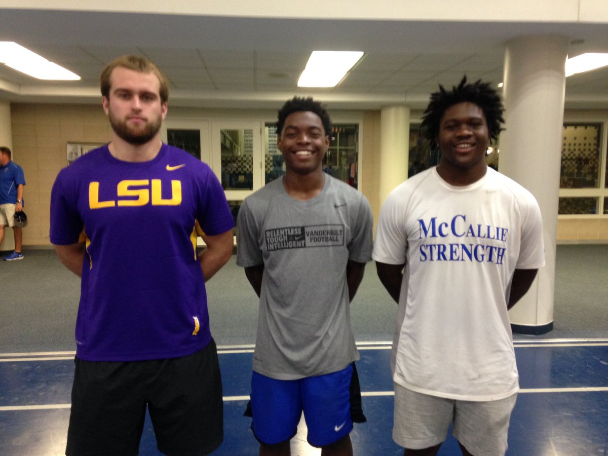 Kendall Watson (center) earns honor to wear No 17 for <a href="/McCallieFB/">McCallie Football</a>, presented by M Brock(left) and A Busby(right).