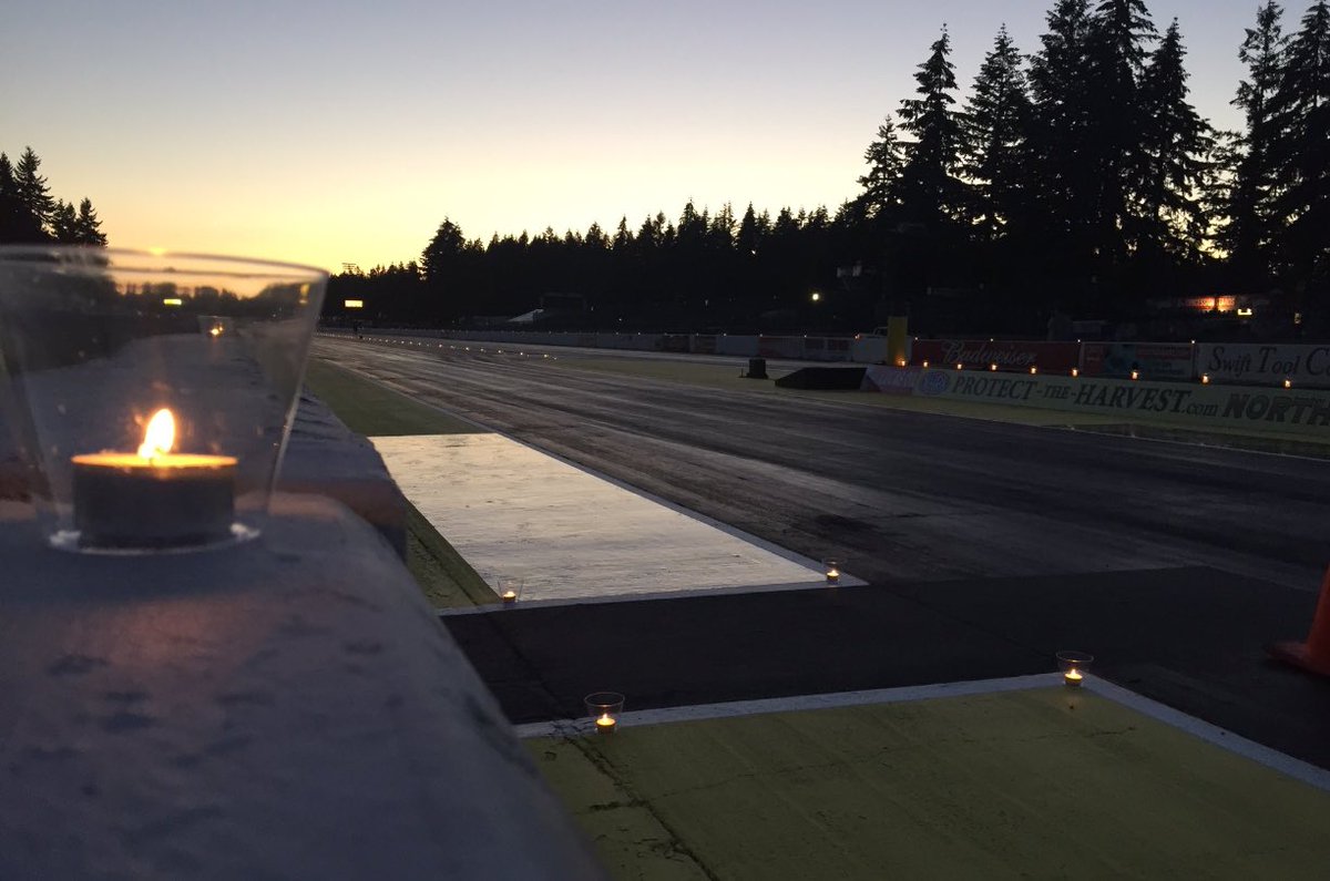 NHRA's tweet image. The racing community took part in a candlelight track walk for Starter Mark Lyle tonight in Seattle. #RIPMarkLyle
