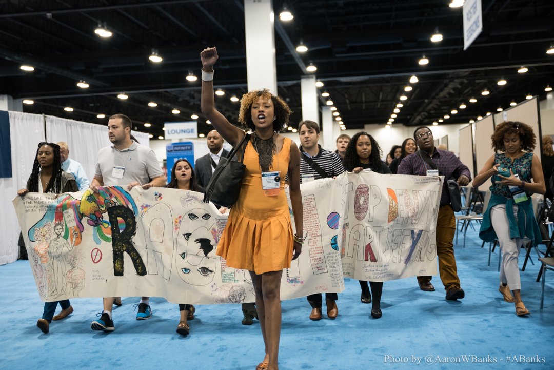 AaronWBanks's tweet photo. Shout-out to the woman who led #APA2016 #protest. Tag her if u know her!
#M4BL #APA2016 #APABLM #Ψ4BL #BLM #DoNoHarm https://t.co/dTv2OEewT3