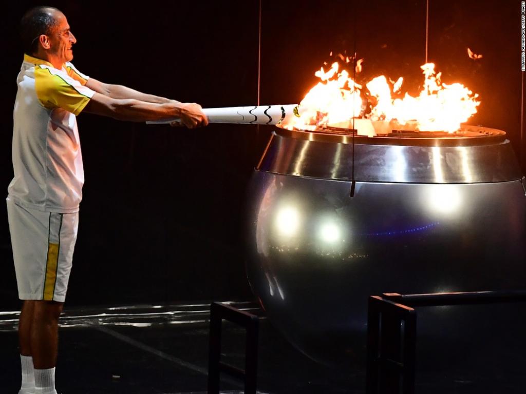 CNN's tweet photo. The flame is lit in the #OlympicCeremony and "Rio is ready to make history" https://t.co/vNTLd2rfwK #RioOlympics2016 https://t.co/bVUEuauX5c