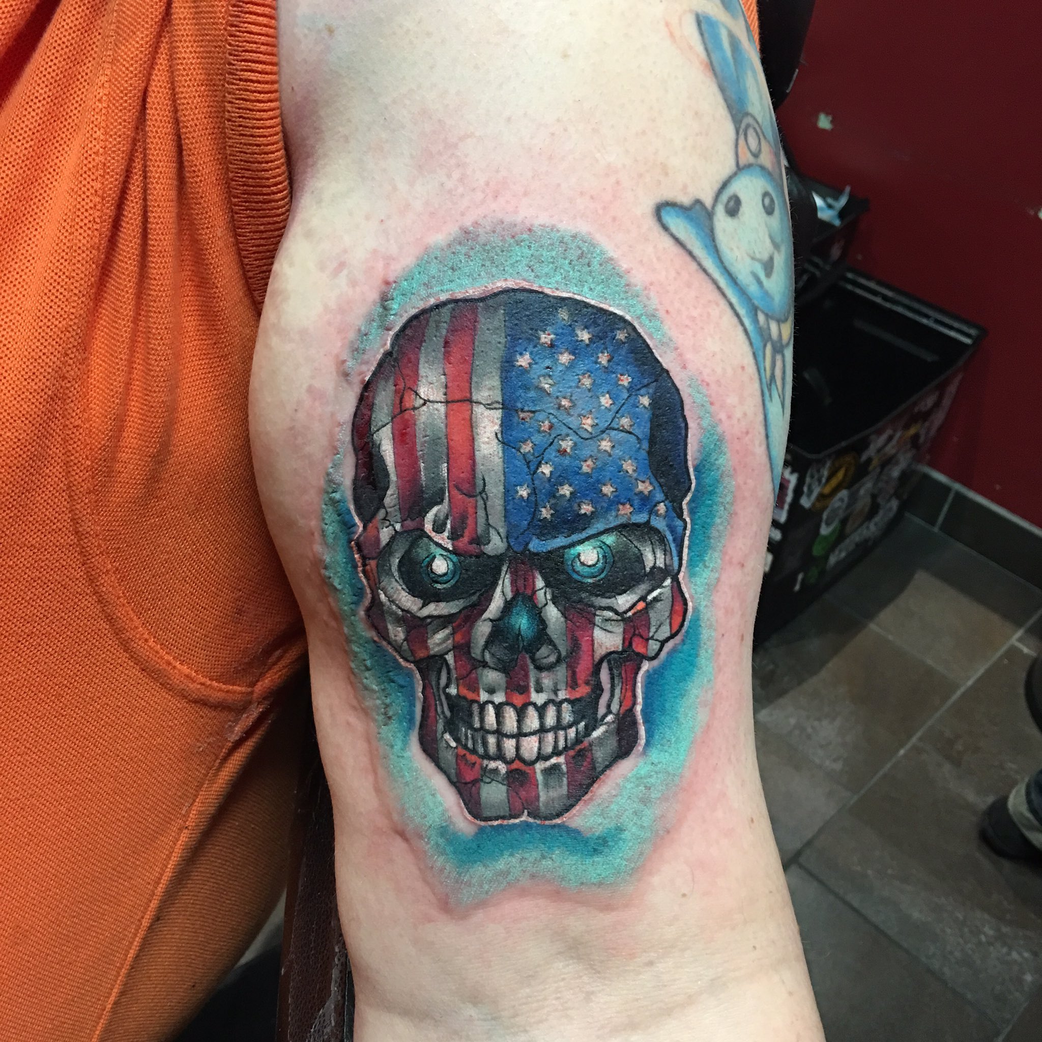 American Flag Skull Tattoo Ripping Through Skin  Ripped skin tattoo  Picture tattoos Skin tear tattoo