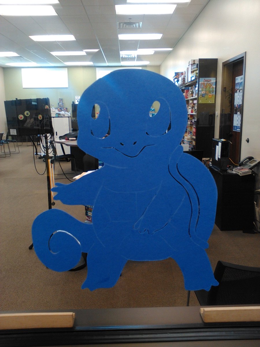 StephFFrey's tweet photo. My pokemon window is done. Yay x-acto knives and construction paper! #pokelibrary https://t.co/MC8MnP7bKW