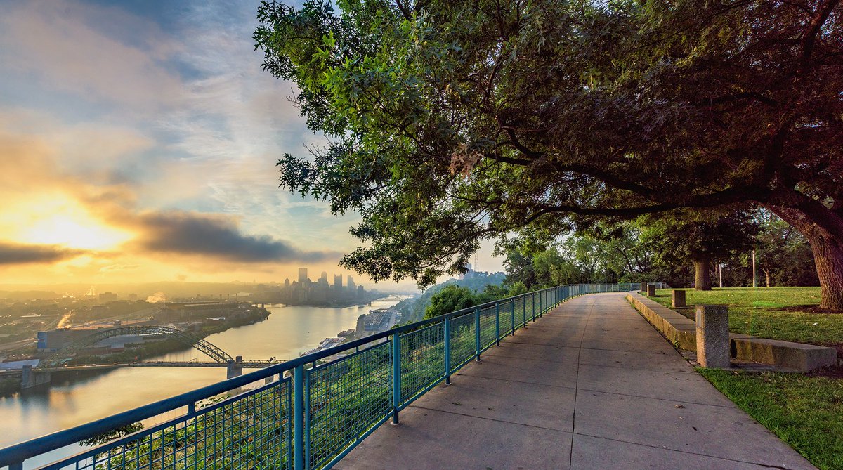 DaveDiCello's tweet photo. Trees frame the path on the West End as golden sunlight pours through the clouds on a beautiful #Pittsburgh morning https://t.co/M1QoWO6Att