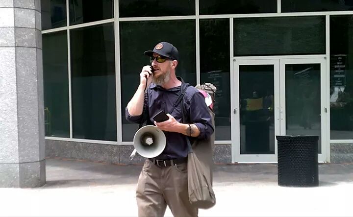 TruthExposedMD's tweet photo. Raymond Schwab speaking in front of CNN headquarters in DC. https://t.co/6DeB91OiAB