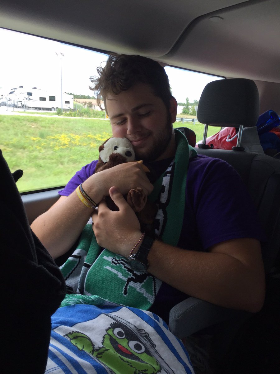 ESUAmbassadors's tweet photo. Here we have Barret, cuddling our new Ambassadors mascot "Aric with an A" on the way home to Emporia... #CASEASAP16 https://t.co/6bwnH1yBik