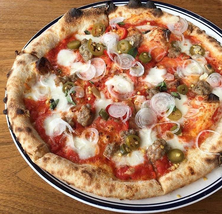 Have you tried our Hot Peppers pizza? Think fennel sausage, spring onion, mozzarella and peppers| Photo by <a href="/foodgps/">Josh Lurie-Food GPS</a>