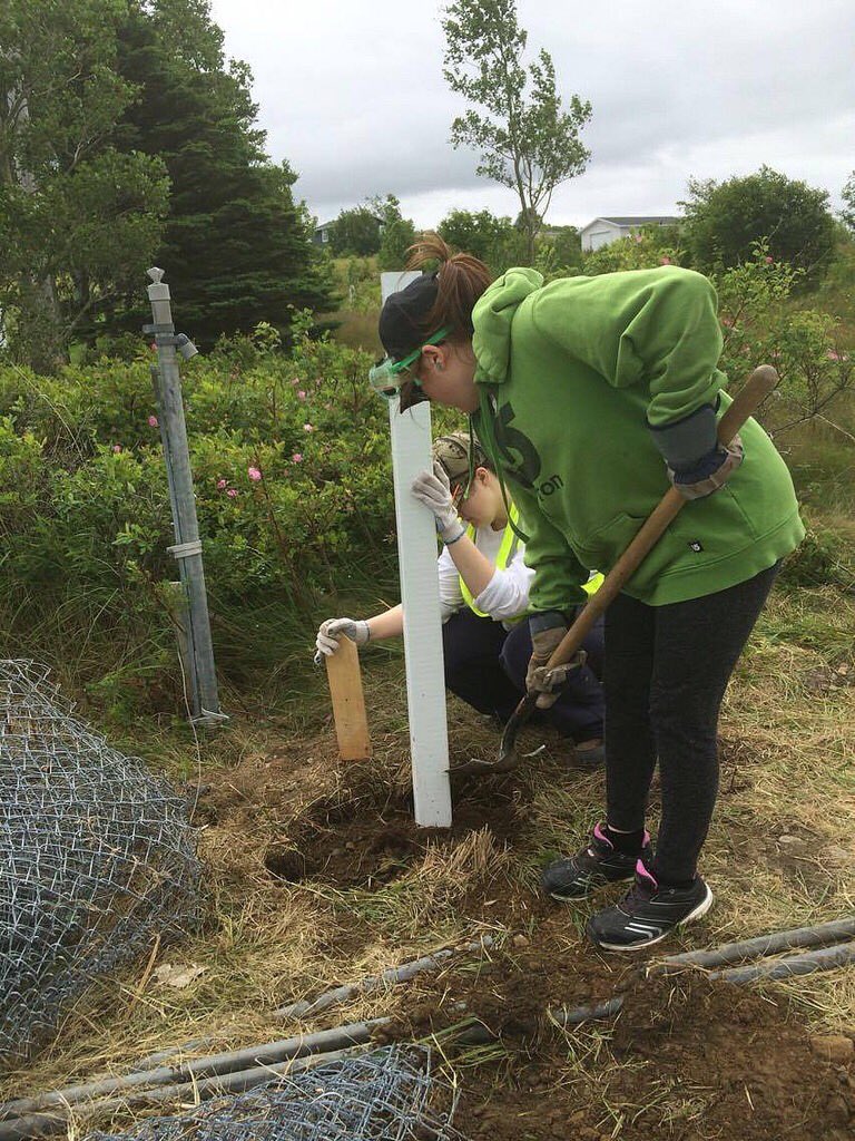 CorpsNL's tweet photo. Putting in new fence posts in the heritage district in Heart's Content! #ccnl2016 https://t.co/tZoSpzcpgj