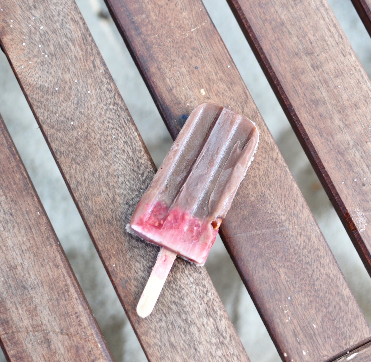 Try our new fudgesicle! Made with chocolate milk and raspberries! #Popsicle