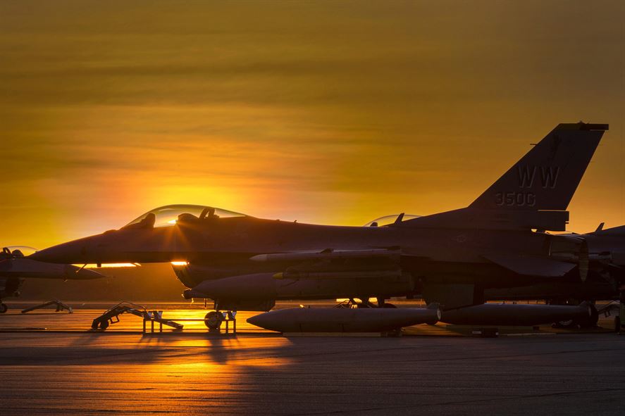 DeptofWar's tweet photo. Rise &amp; Shine: @usairforce F-16 Falcon sits on the tarmac during Exercise Pitch Black 16 @Aus_AirForce Base Darwin https://t.co/6ZVP4KLCxv