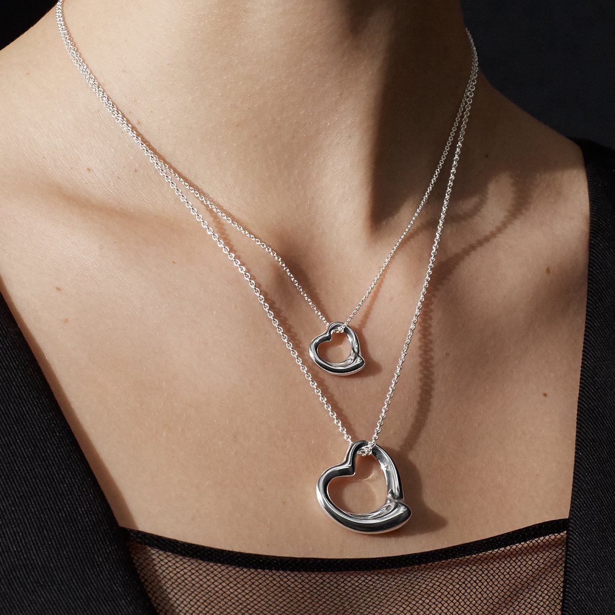 Elsa Peretti™ Open Heart pendant in 18k gold with diamonds. | Tiffany & Co.