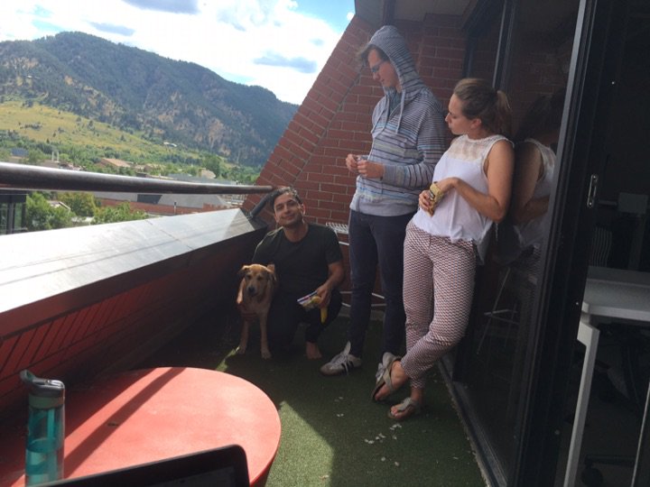 A few members of our team enjoying the sunshine, beautiful view, and some snacks!