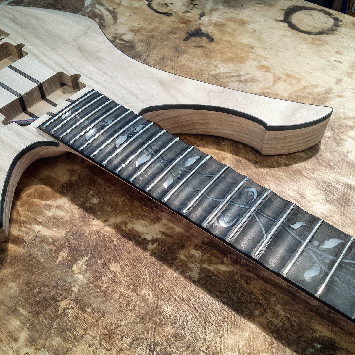 EQGuitars's tweet photo. Hand-shaped scallops and a full color LED-backlit vine-of-life inlay. Custom options to infinity and beyond. #guitar https://t.co/GkfbVwDG79