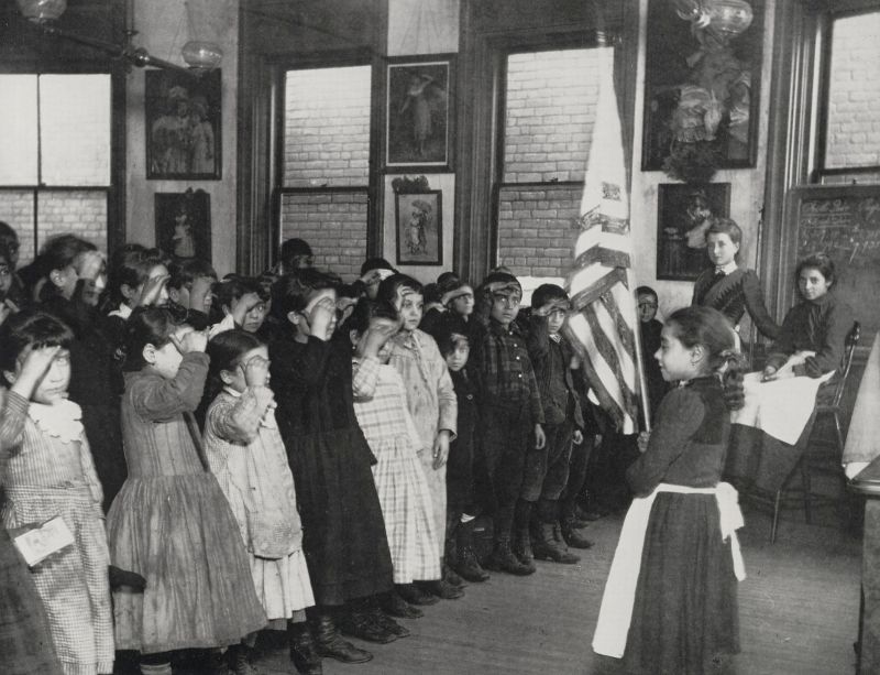 freeRwe's tweet photo. Immigrant children saluting the flag in the Mott Street Industrial School NYC. Poor kids, but grateful #2befree https://t.co/G61AMB6iOO