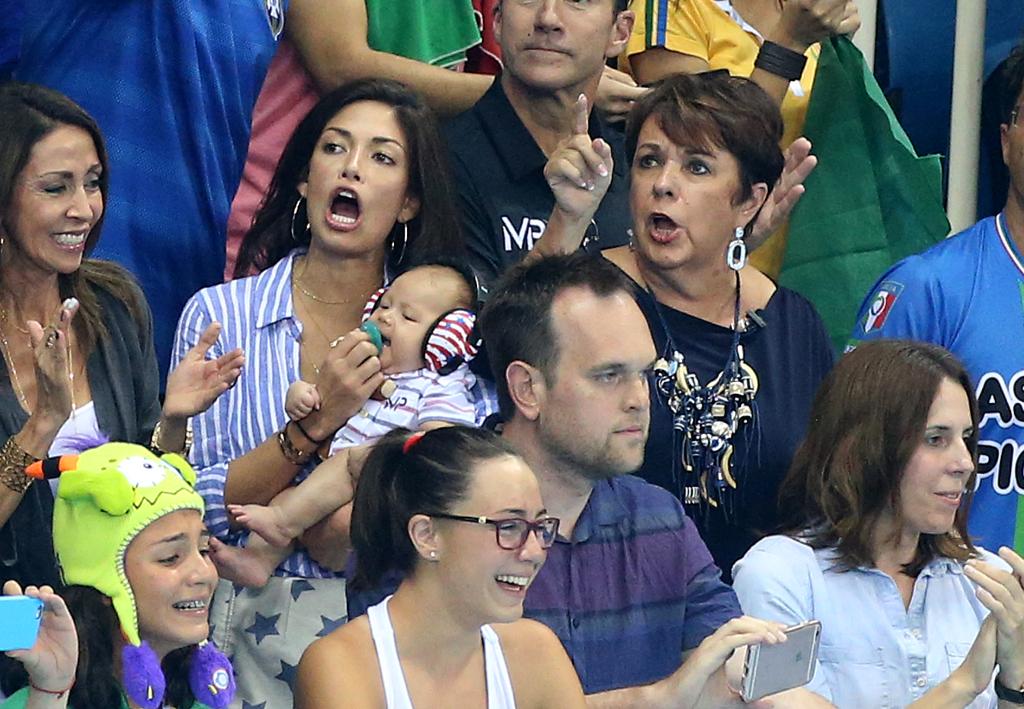 theknot's tweet photo. Michael Phelps has the cutest cheering section at the #Olympics:  https://t.co/VayD35SbIJ https://t.co/1vxdsFg0AR