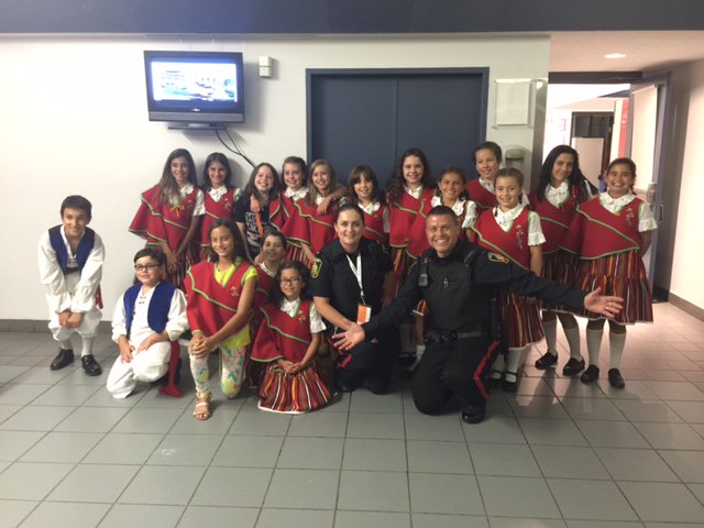 wpgpolice's tweet photo. Two of our officers at the @PortugalPav with the very talented children's group! #folklorama47 @Folklorama https://t.co/iHNWDDK4rl