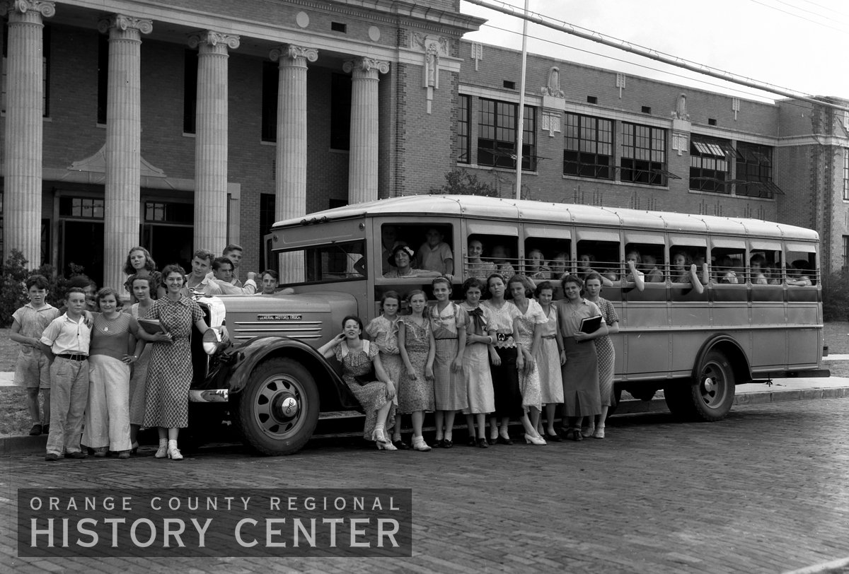 HistoryCenterFL's tweet photo. #WaybackWednesday Students gathered around a school bus in front of Orlando High School circa 1930. #HowardMiddle https://t.co/n1oPDo8VDj