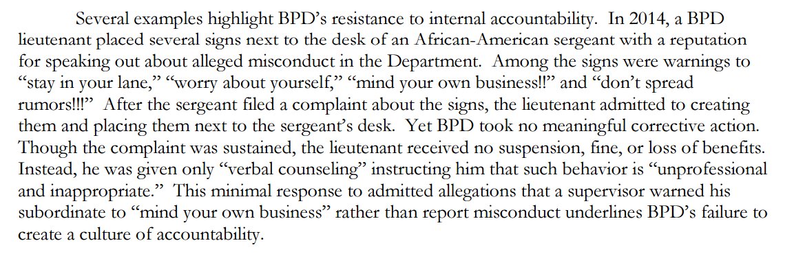 bradheath's tweet photo. Baltimore Lt. put up signs around the desk of a black sgt. who had reported misconduct to "mind your own business." https://t.co/CEWI4v3qJz