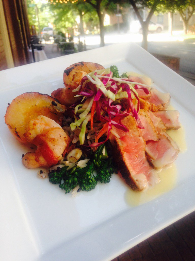 Tonight we are featuring  Blackened Ahi Tuna with bacon wrapped shrimp and grilled plums over a bed of rice. Yum !