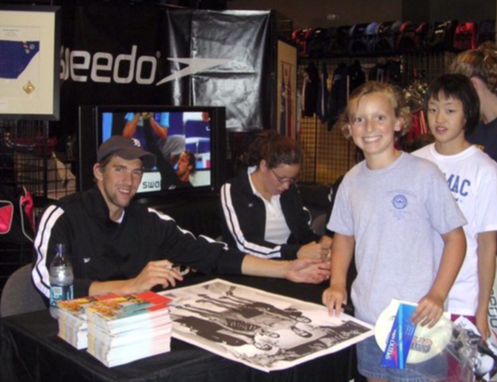 NBCOlympics's tweet photo. THROWBACK: 9-year-old @katieledecky was all smiles while getting @MichaelPhelps' autograph! 

(NYT/Ledecky Family) https://t.co/VrTrBanoL2
