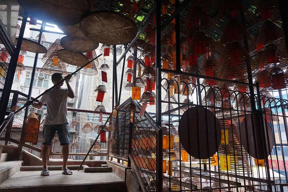 Early morning incense rituals at Pak Shing Temple.