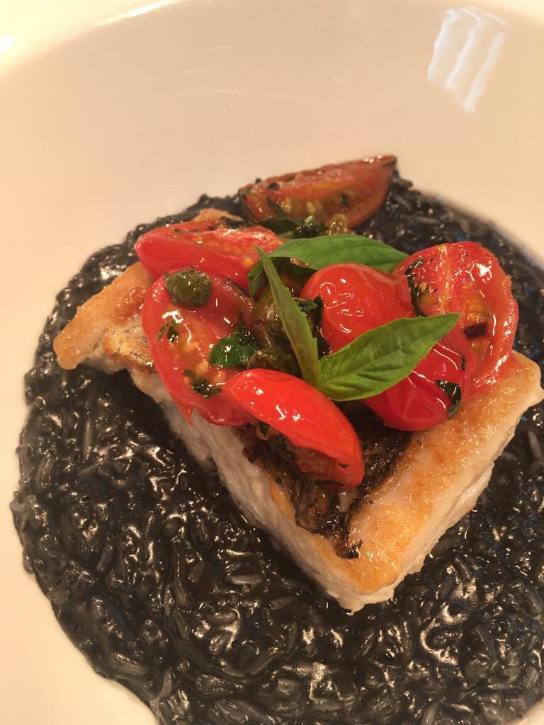 kou52uk's tweet photo. Squid ink risotto with Cornish hake and puttanesca  https://t.co/shk2C1cEde https://t.co/hxSNDjEfyv