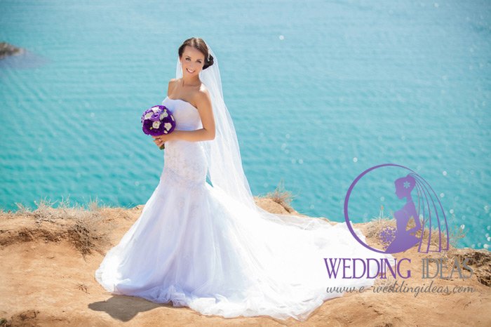 A-line #gown with strapless straight necklace and tulle skirt with train. #Bride #dresses at e-weddingideas.com/2016/03/21/the…