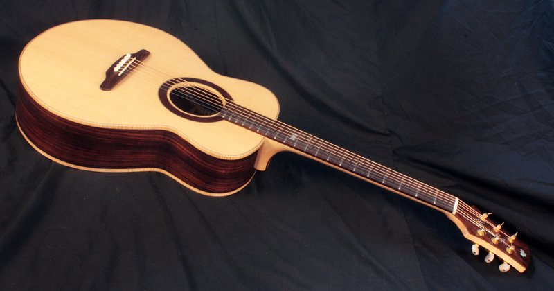 Made from very, very old rosewood from his retired cabinet maker uncle. Joe's ASAP with 4 piece back.