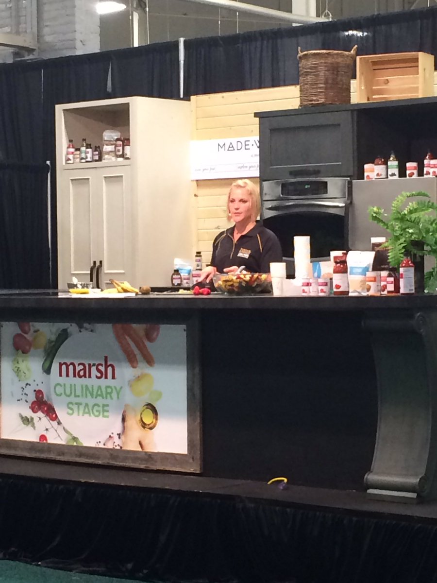 HHS Educator Monica Nagele doing a cooking demo for Rainbow Fruit Salad at the Indiana State Fair.