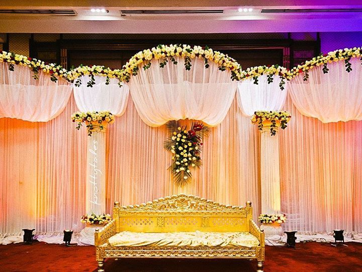 Loving the elegant touch of amber accent #uplighting on this #weddingalter! Photo via #knottytles