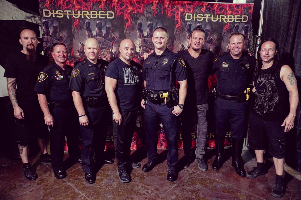 Disturbed's tweet photo. Thx to Brent Wright &amp; the North Richland PD for being our guests at the show tonight in Dallas #disturbedtour2016 https://t.co/dyXoo0phcN