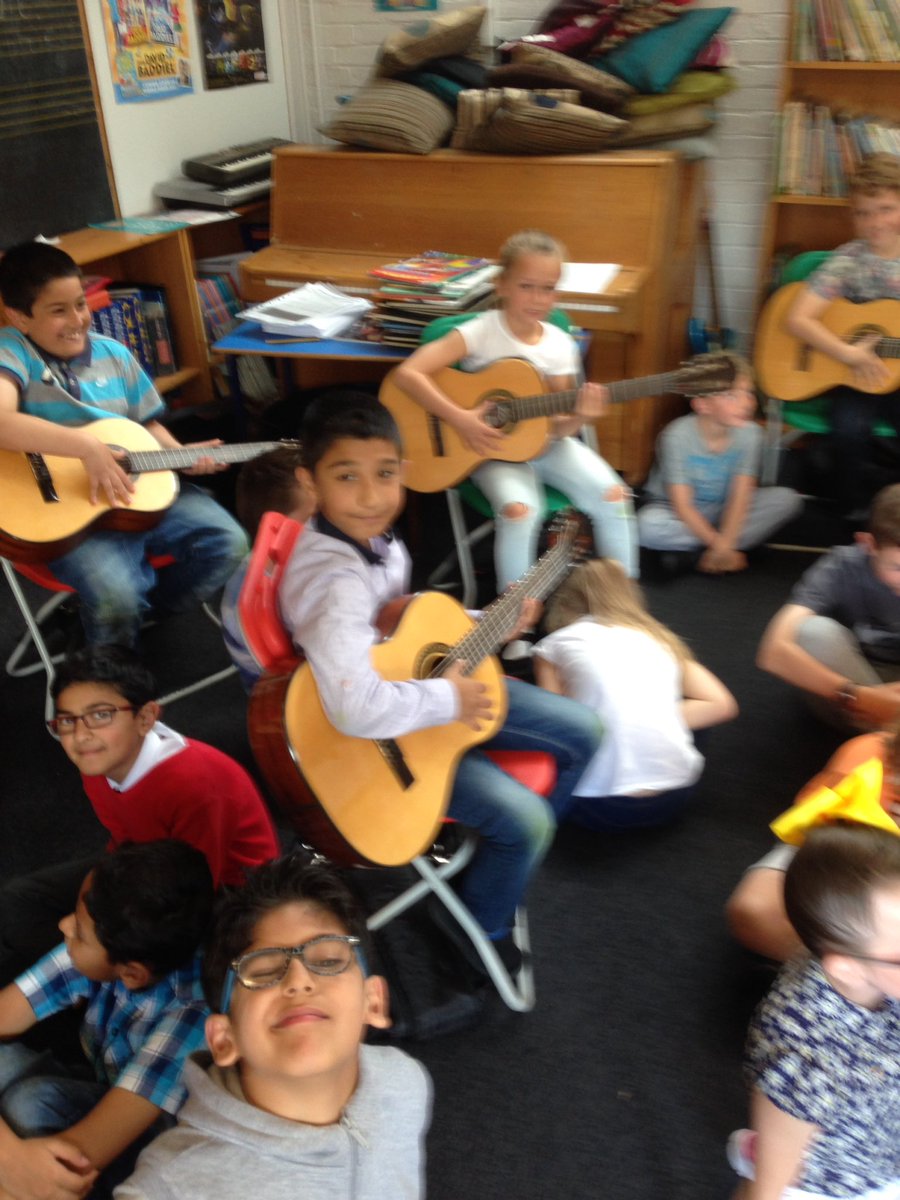 St_Angelas_Pri's tweet photo. P5s enjoying 1st lesson with guitars from @GlasgowCREATE #bigstrum initiative https://t.co/CQMhmpWH9Z