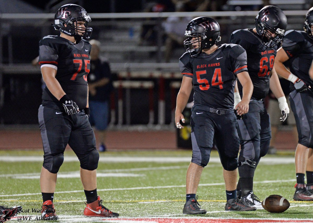#54 Jacob Sanchez, #69 Cooper Udall and #75 Keegan Hornung getting ready for the snap.