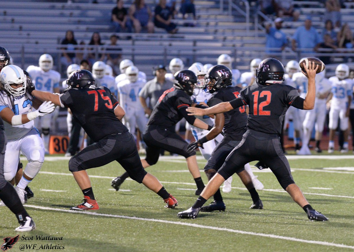 #12 Zack Shepherd throwing the ball from the pocket. <a href="/WFFootballTeam/">WF Football Boosters</a> <a href="/WFHSBigRedRage/">BIG RED RAGE</a>