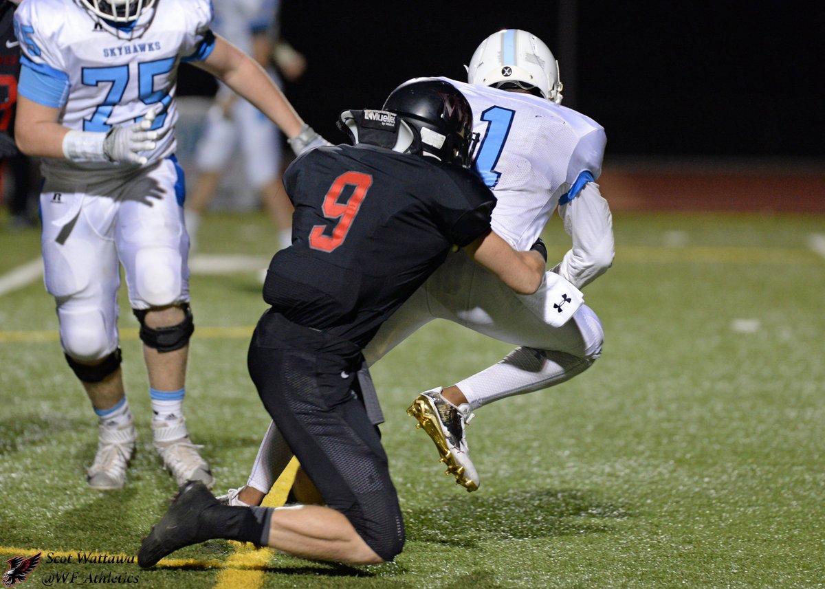 #9 Talon Bingham wrapping up the runner.