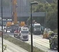 HighwaysSEAST's tweet photo. #M20 #Kent J1 - J4. Crews are in the process of removing remaining bridge structure from the carriageway. https://t.co/nA31StQaYI