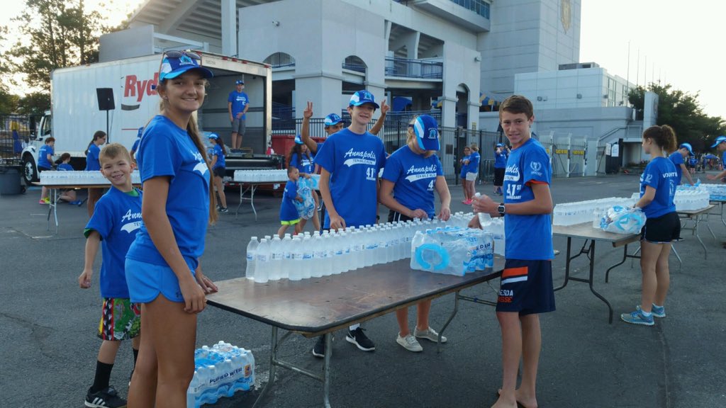 Cross Country helping out at the Annapolis 10k. #lotsofwater #cougarpride