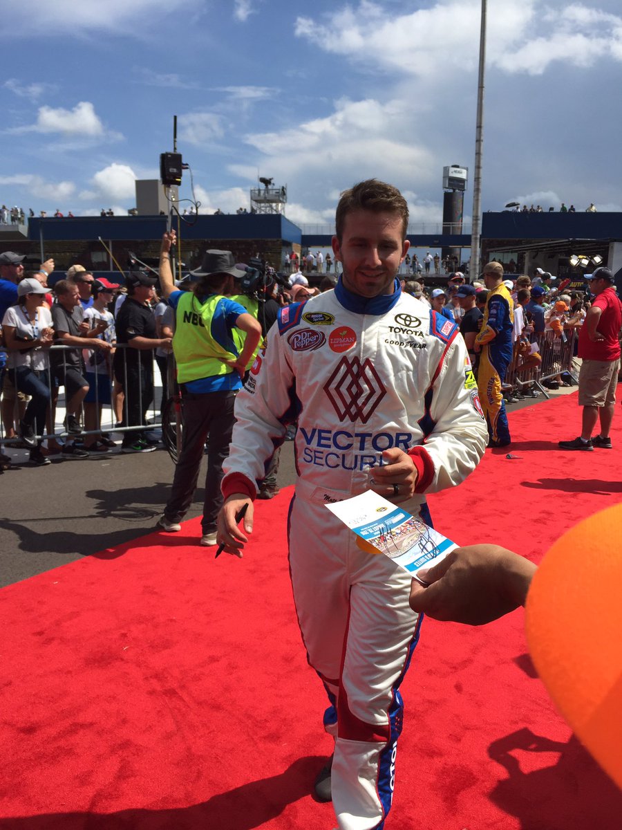 VectorSecurity's tweet image. #83 @mattdracing signing autographs on the @MISpeedway red carpet. @BKRacing_2383 #VectorSecurity