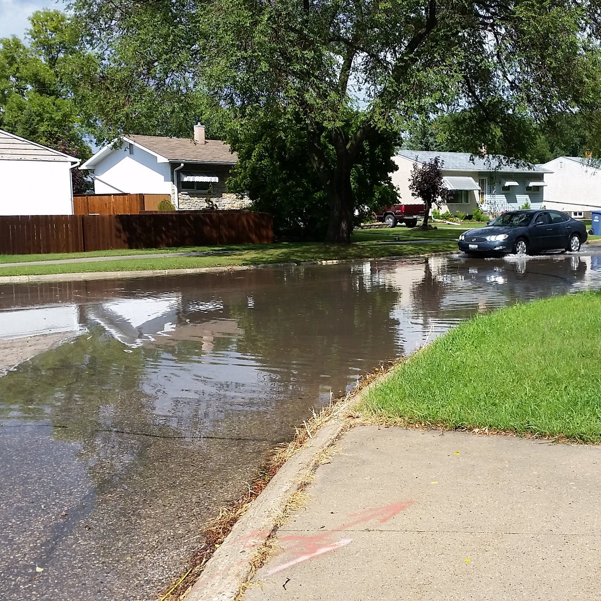 wpg_msmith's tweet photo. Lake Autumnwood has filled up again. Just in time for the annual street fishing derby. #wpgstorm #mbstorm #Winnipeg https://t.co/C7aG2Gm18v