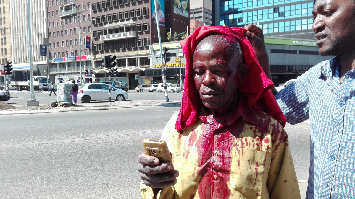 Musvanhiri's tweet image. Riot police crash #NoToBondNotes protest in Harare. Demonstrators beaten b4 they cld march.