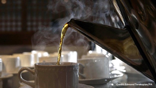 A cup of tea is poured