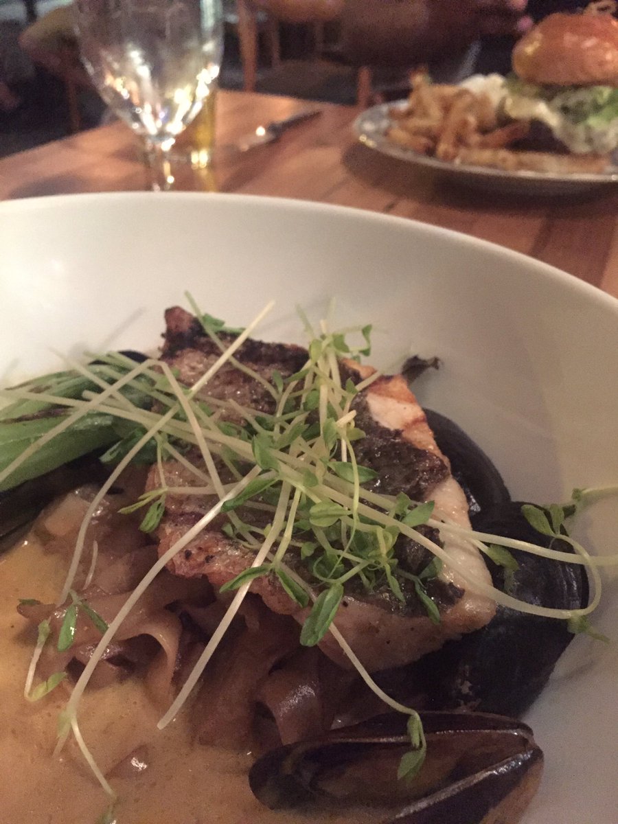 lizerbes's tweet photo. Beautiful dinner @tausauthentic tonight.  @Michael_Taus  Striped Bass over rice noodles in Red Coconut Curry broth https://t.co/khsia0toAo