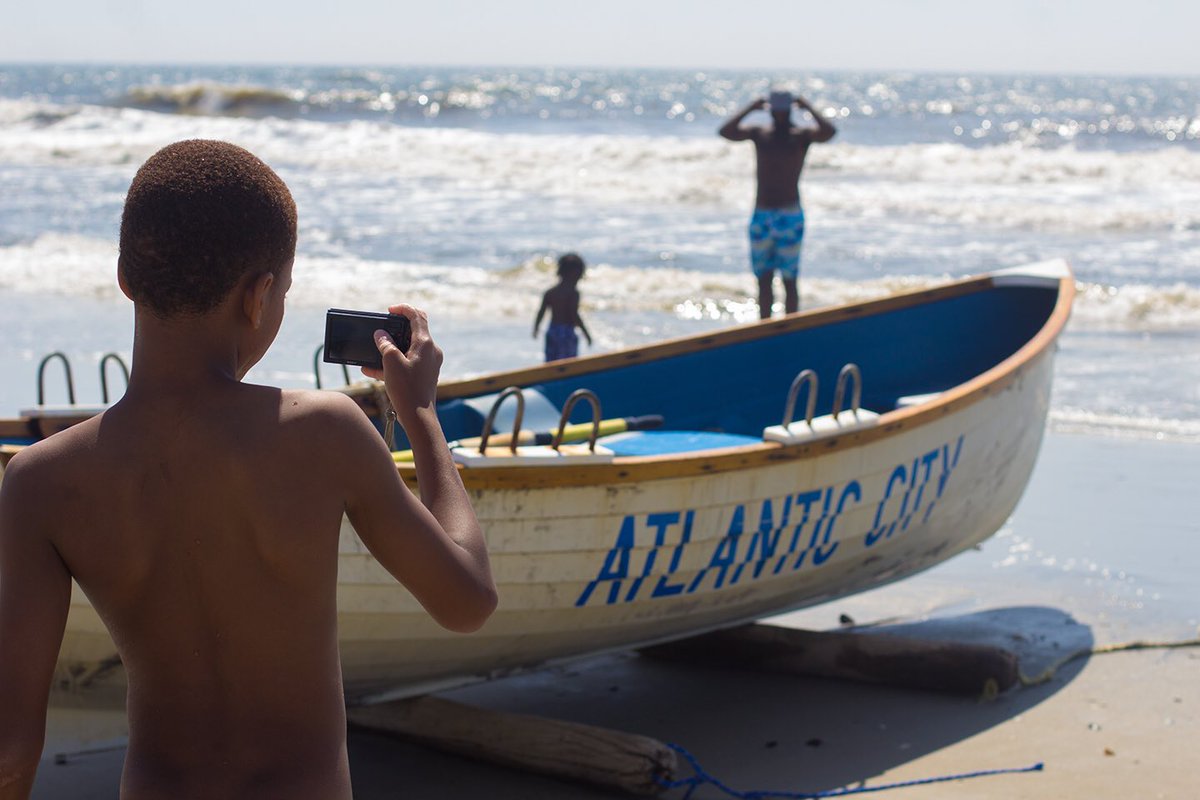 Dominique photographing a lifeguard boat at a daylight color temperature of 5,000K. #cscphotocamp #lightshooters