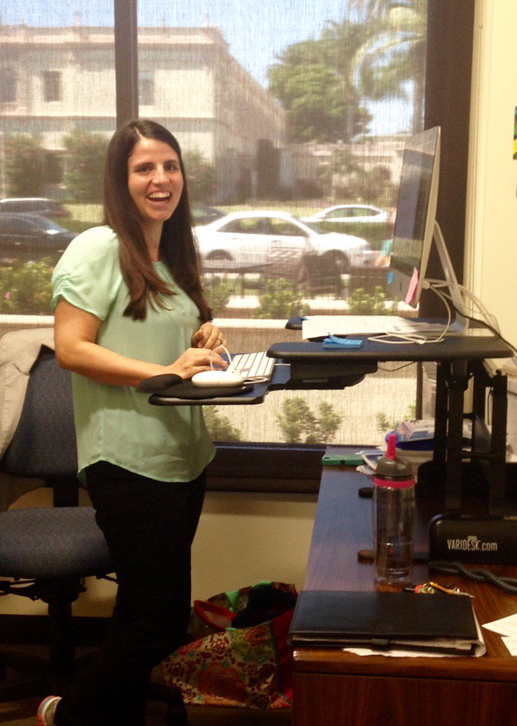 Niki Barrios, CDev Event/Marketing Specialist at her new stand-up desk <a href="/usdcareers/">USD Career Center</a>