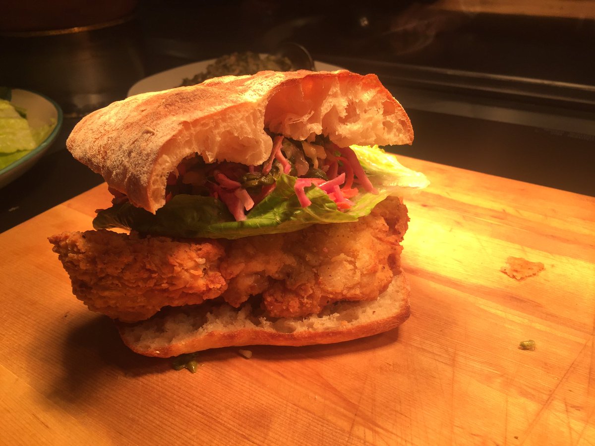 Good lookin fried chicken and pickle slaw sandwich today at <a href="/CATDCLT/">Coco&TheDirector</a> get over quick before they are all gone!