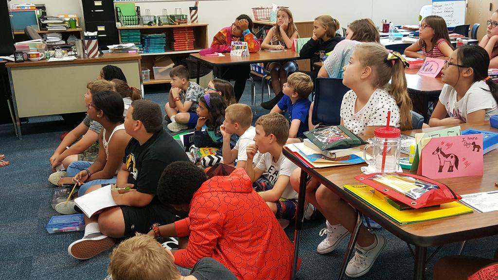 Mrs. Holmes' class thinking about what they know to be true about reading- what reading means to them. #NKCschools