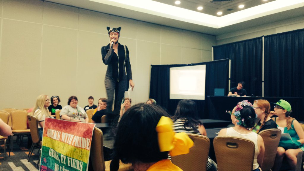 QueerConOttawa's tweet photo. The indomitable @BlueBurlesque is hosting Geek Trivia right now at #QueerCon! #meow #catwoman #Pride https://t.co/laEPpQfzVR