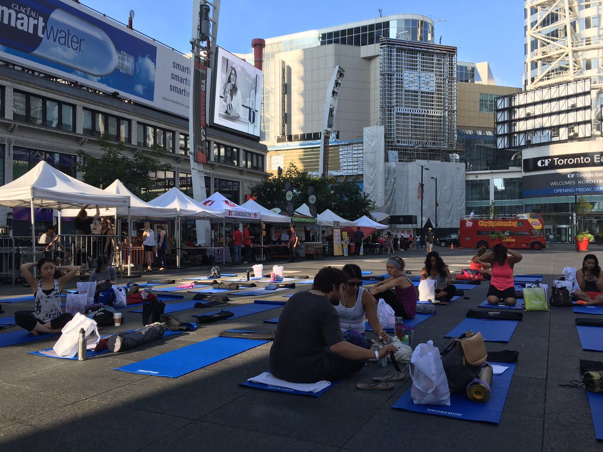 idayofyogacan's tweet photo. @YogathonToronto 108 Sun Salutations about to bit at young and Dundas Square. @YDSquare @Kathleen_Wynne https://t.co/2bu2B0Eckd